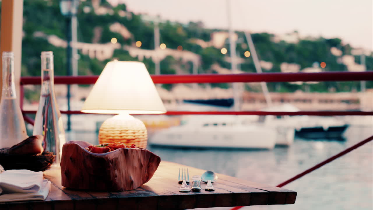 Close up view of a lamp on a set table at a restaurant near a port in the south of France