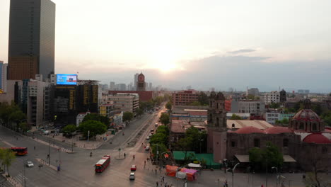 Forward-reveal-shot-of-wide-street-in-low-traffic-hour.-Downtown-life-at-twilight.-Mexico-City,-Mexico.