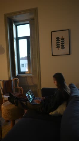 woman working on laptop at home