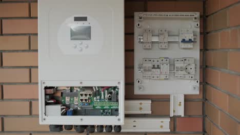 an electrician installing an inverter in a home. the image shows technical skill, modern tools, and attention to safety in electrical work