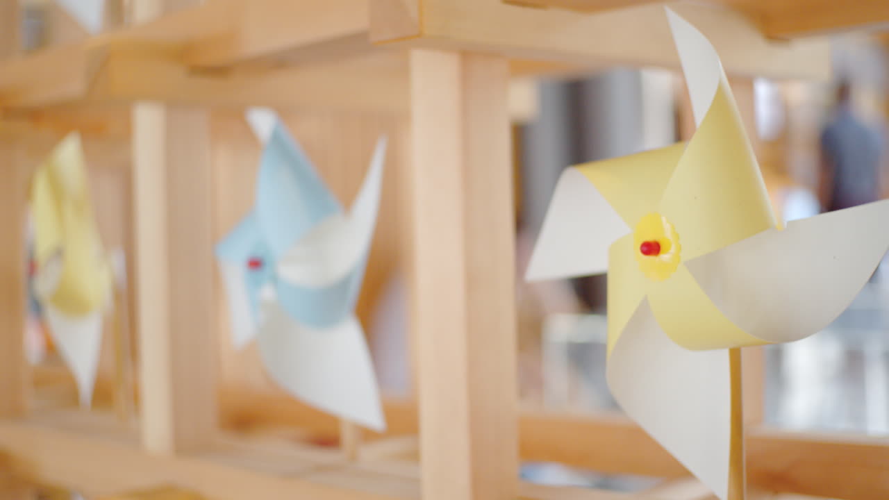 Colorful Paper Pinwheels on a Wooden Display