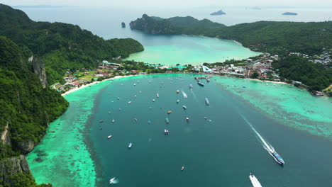 aerial forward land bridge with hotel resort on island koh phi phi, thailand