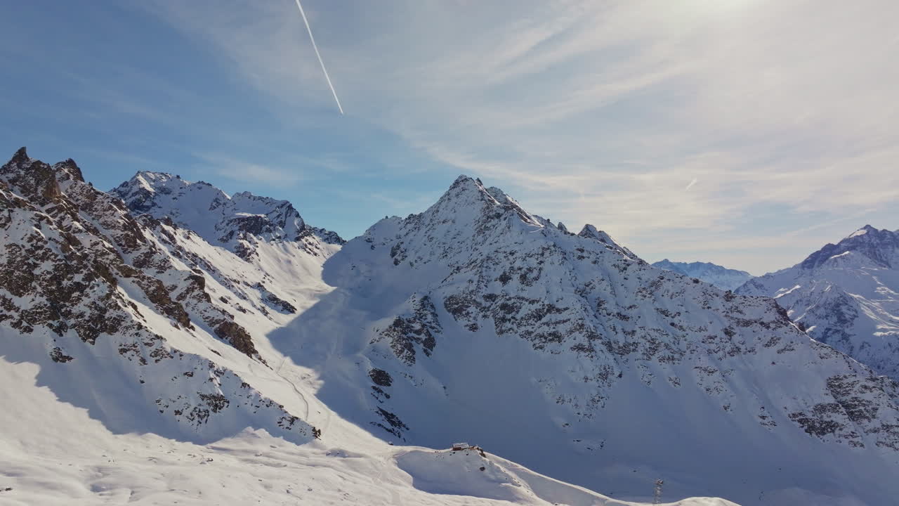Aerial views of high alpine peaks in Verbier, Switzerland, with the iconic Bec des Rosses towering in the background.