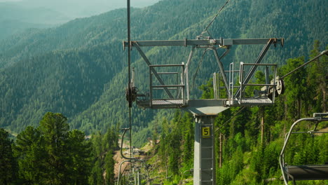 chairlift automatic system for moving uphill on cable car with incredible view of beauty of nature. transport for tourists for quick lift up slow motion