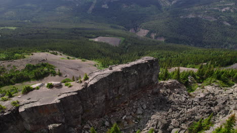 Aerial-over-weathered-rocky-ridge-on-mountainside,-British-Columbian-nature