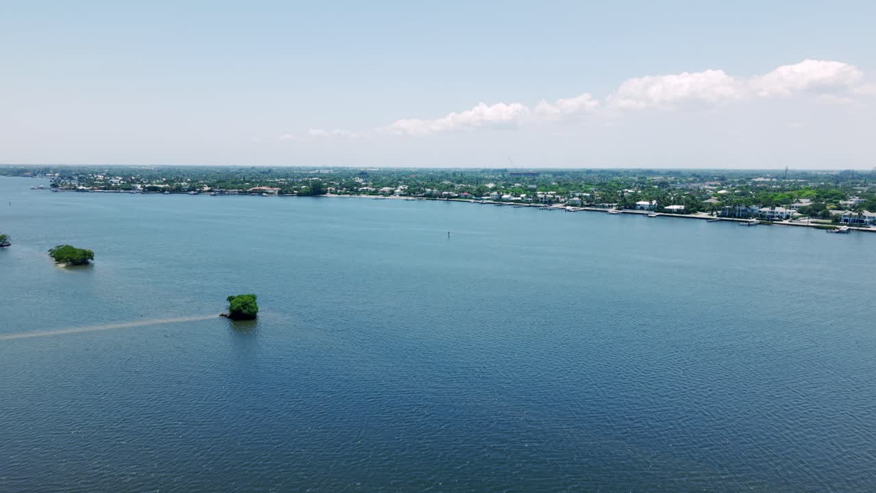 Drone above calm blue ocean waters off South Flagler Beach, West Palm Beach