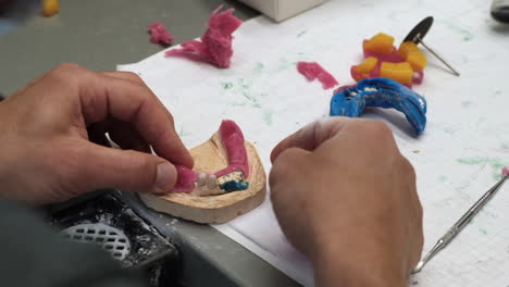 Slow-Motion-Dental-Technician-working-on-a-dental-Skeletal-prosthesis