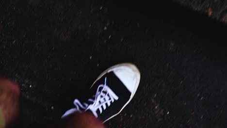 A-set-of-legs-with-converse-shoes-on-slowly-makes-their-way-up-a-few-wet-stairs