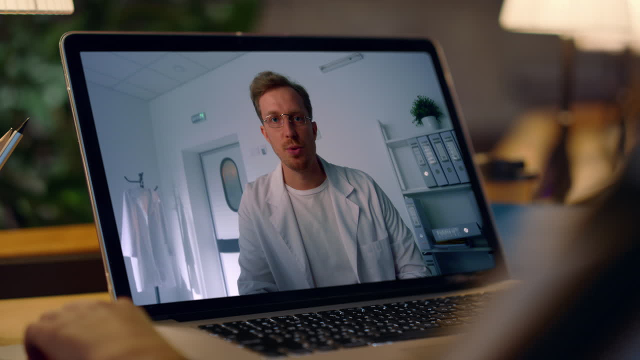 Telemedicine Consultation with Doctor on Laptop