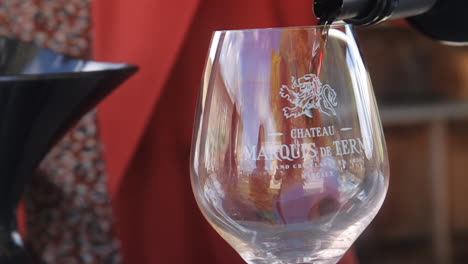 wine being poured into a glass