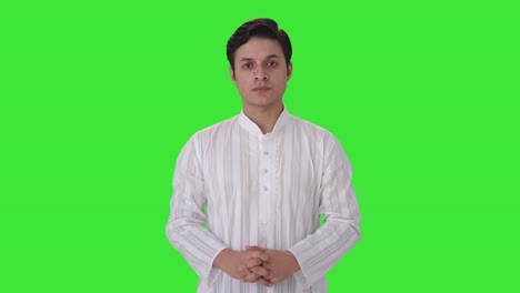 angry indian man looking at the camera green screen