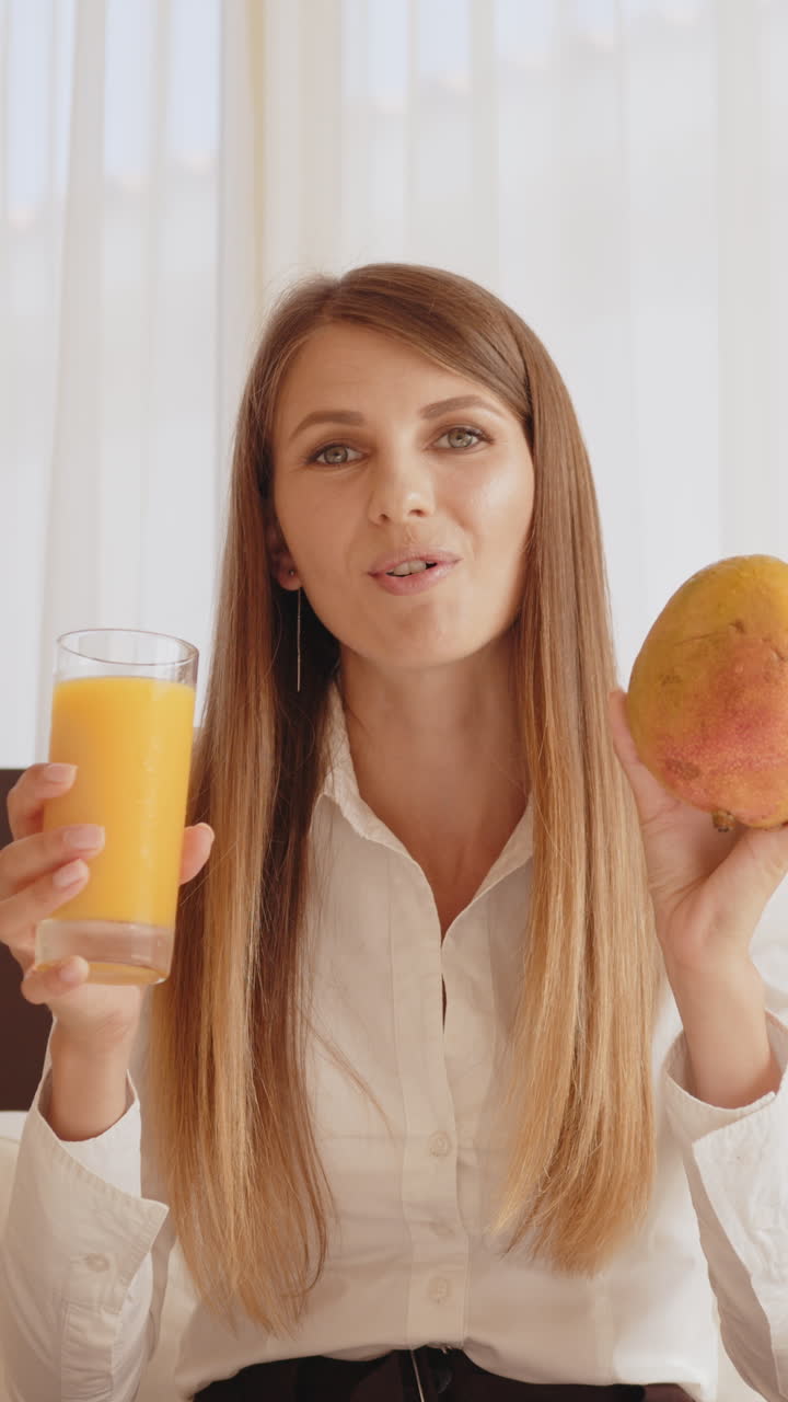 Woman with mango and juice
