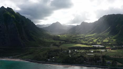 wide aerial panning shot of hawaii's majestic jurassic valley along the coast of o'ahu