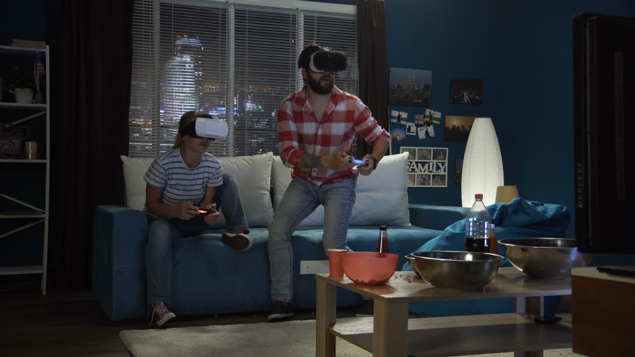 Couple playing VR games at home