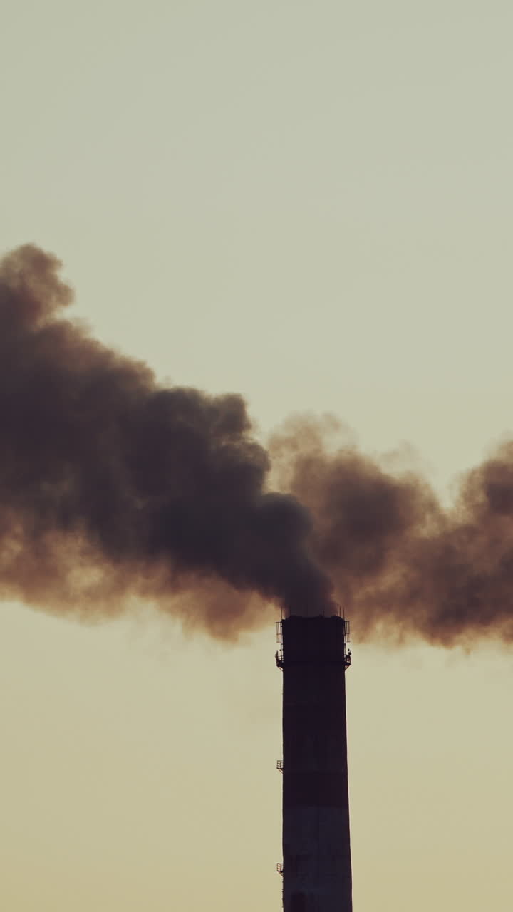 Air emissions from an industrial pipe. Stack releasing smoke and pollution to the atmosphere