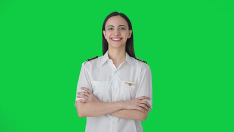 portrait of happy indian woman pilot green screen