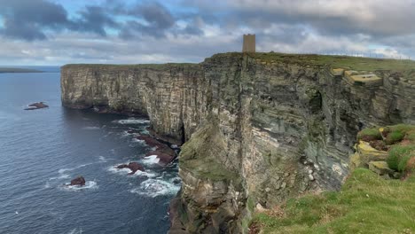 Walkers-with-gulls-and-fulmars-and-other-sea-birds-on-Marwick-Head-cliffs,-Orkney,-Scotland