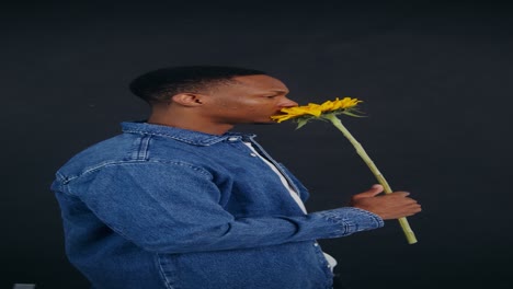 man holding sunflower