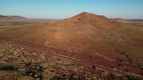 Aerial-view-of-empty-road-in-National-Park-at-sunset-in-Australia