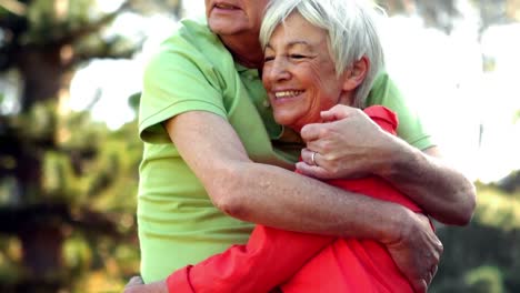 Senior-couple-embracing-in-park