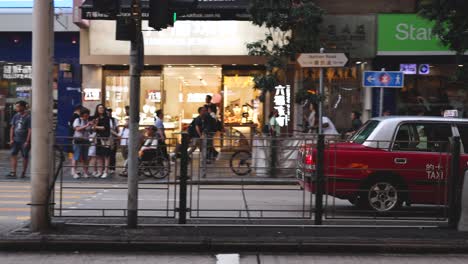 taxis and pedestrians at a bustling intersection