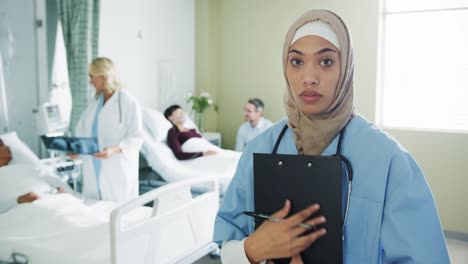 Young-female-intern-making-notes-in-a-hospital-ward-4k