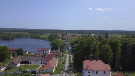 nice aerial top view flight rural village chlum on lake in czech republic europe, summer day of 2023