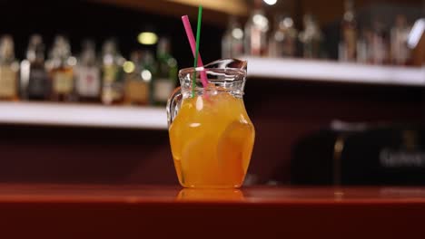 iced orange drink in a pitcher