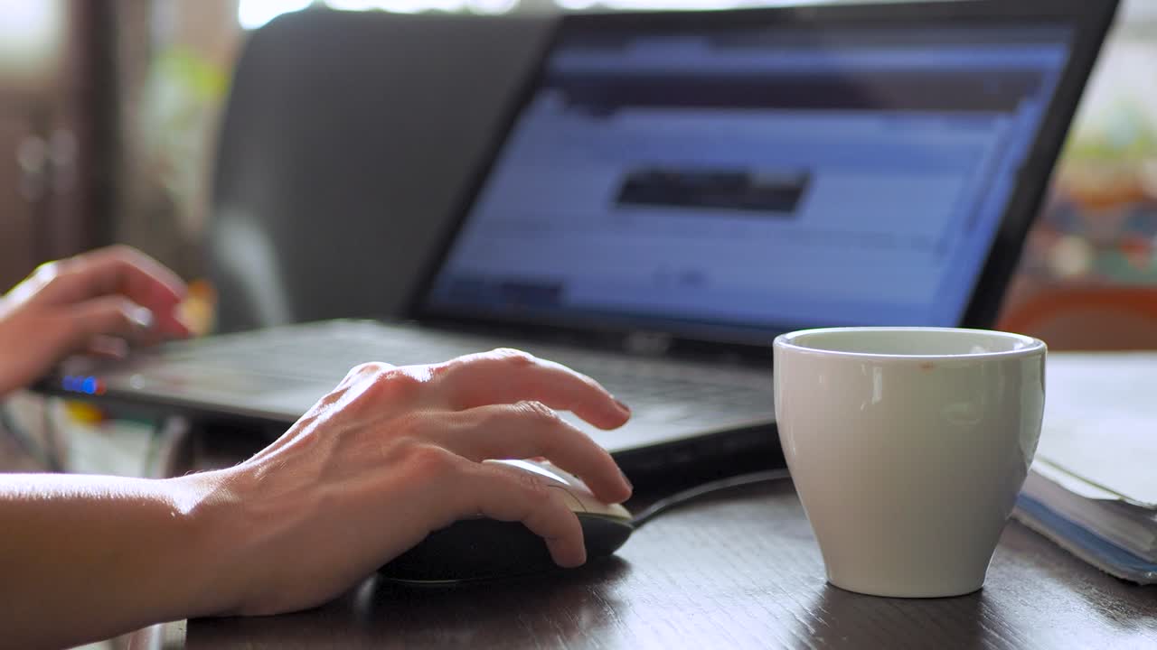 Woman work on home office, female freelancer work from home. Working at home during pandemic. Typing on keyboard, working on laptop, using a mouse. Stay home, save lives. Close up. Scene G.