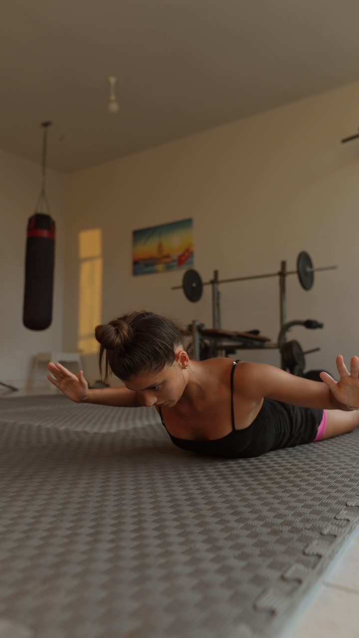 Woman Doing a Plank Exercise in a Home Gym