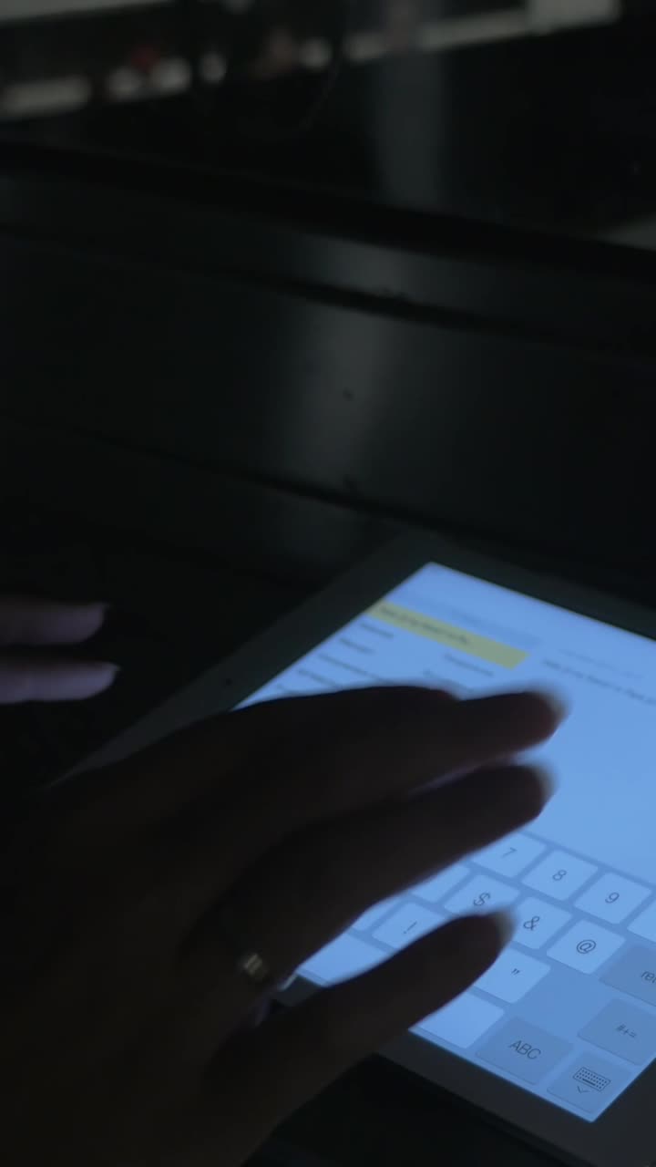 Close-up of Hands Typing on a Digital Tablet Screen