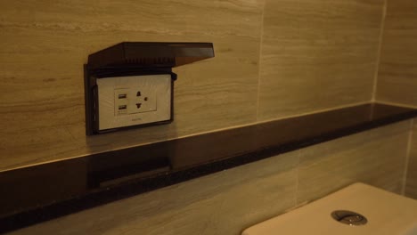 modern electricity outlet socket with cover, close up