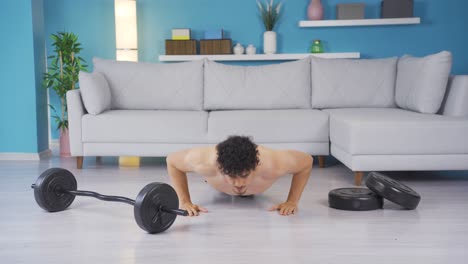 young athlete doing sports at home doing push-ups.