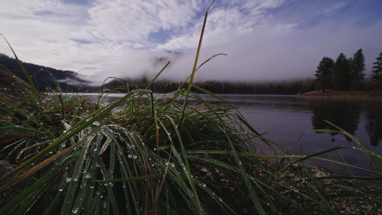 Autumn scene after rain and fog lift on Swan Lake in Montana