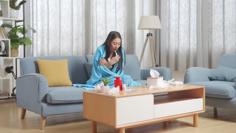 가정에서 온도를 측정하는 여성