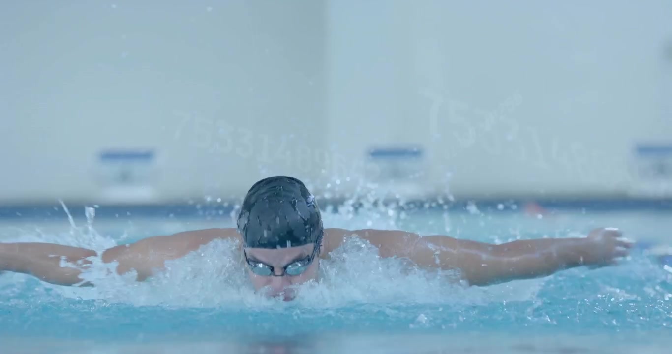 Male swimmer stretching and starting butterfly pull, creating spray with sports analytics overlays