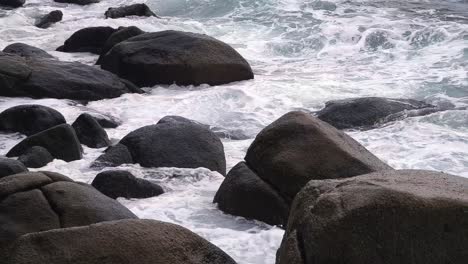 waves crashing against coastal rocks