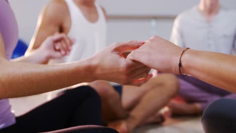 group of people performing yoga