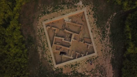 birdseye wonderful aerial shot on ancient ruins of historical academic center in gundeshapur archaeological sites civilization in iran in the miidle east of farm field agriculture land in dezful rural