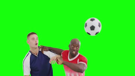 Video-of-two-diverse-male-soccer-players-head-kicking-ball-on-green-screen-background