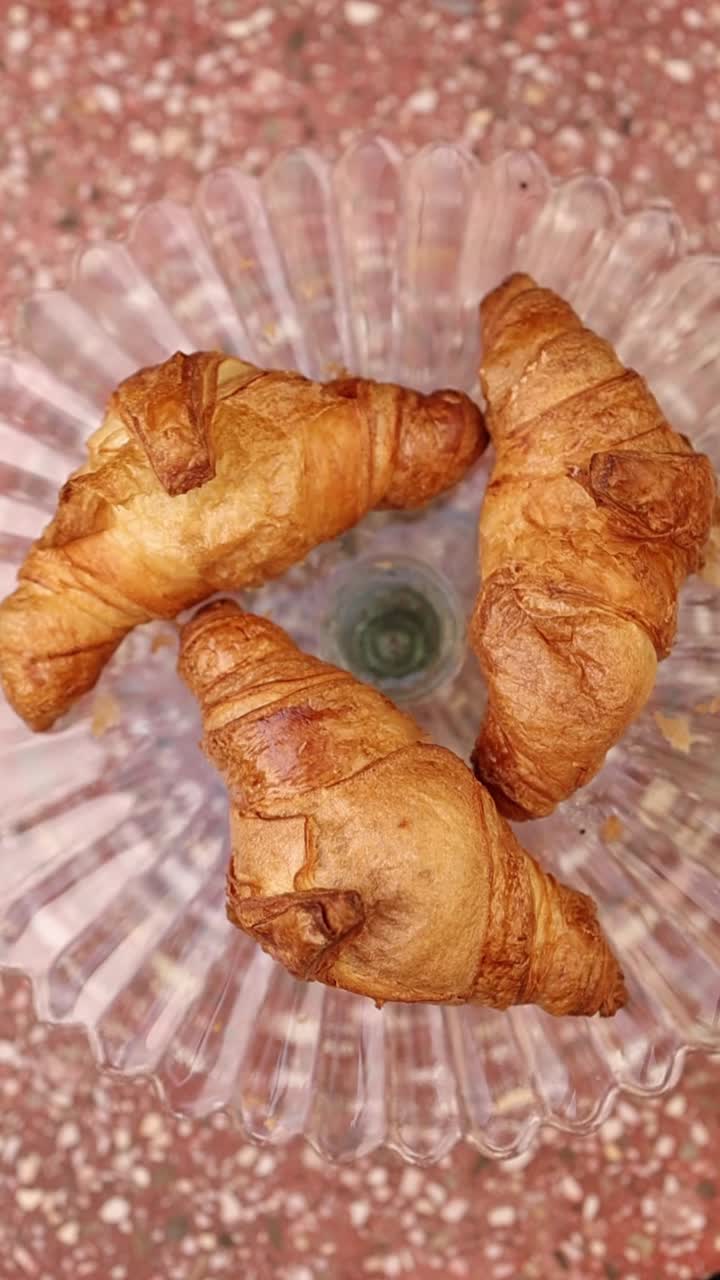 Golden Brown Croissants Arranged on a Glass Plate