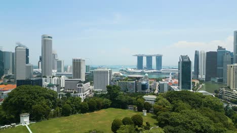 drone ascending over singapore, rising establishment shot of singaporean skyline and seaview