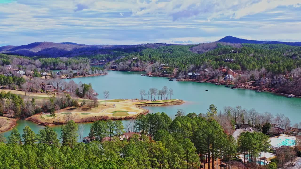 Cinematic aerial pan over Lake Kiwi and the Jack Nicklaus Signature Golf Course of The Reserve at Lake Kiwi.