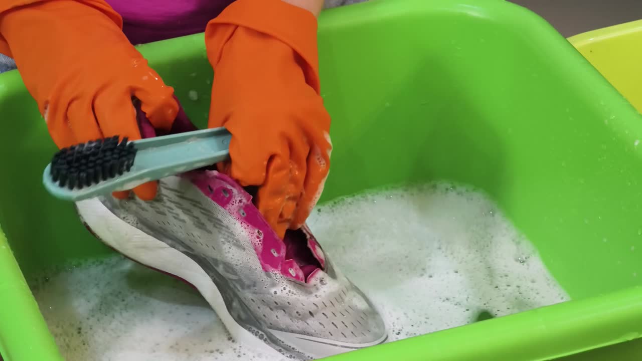 Cleaning a shoe in a basin