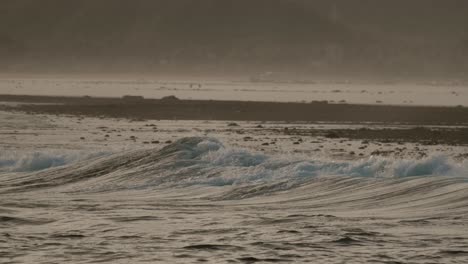 View-on-the-reef-and-the-waves-of-Seger,-near-Kuta-Lombok,-during-sunset