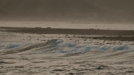 view on the reef and the waves of seger, near kuta lombok, during sunset