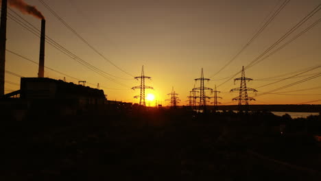 electric tower of high voltage. aerial view of high voltage power lines silhouette