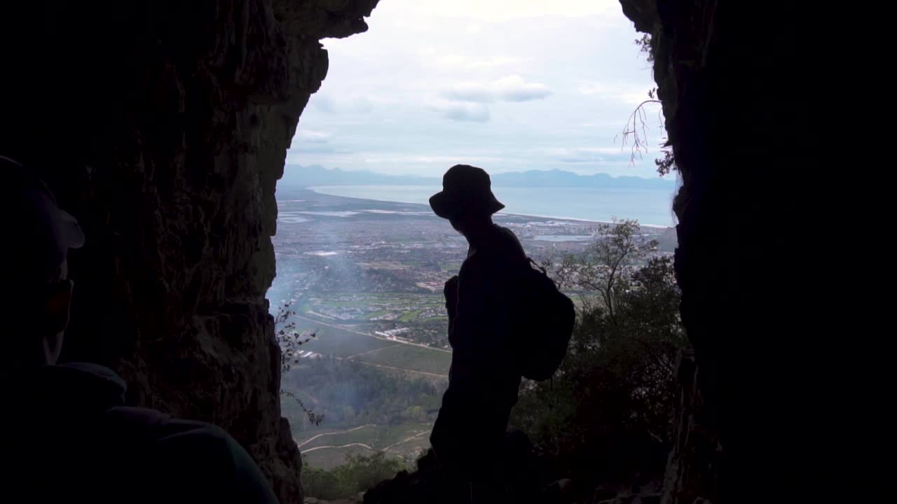 Hikers Observing The View From The Elephants Eye Cave In Silvermine