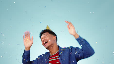 happy man, dance or birthday confetti in studio