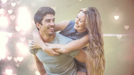 man carrying his girlfriend on his back